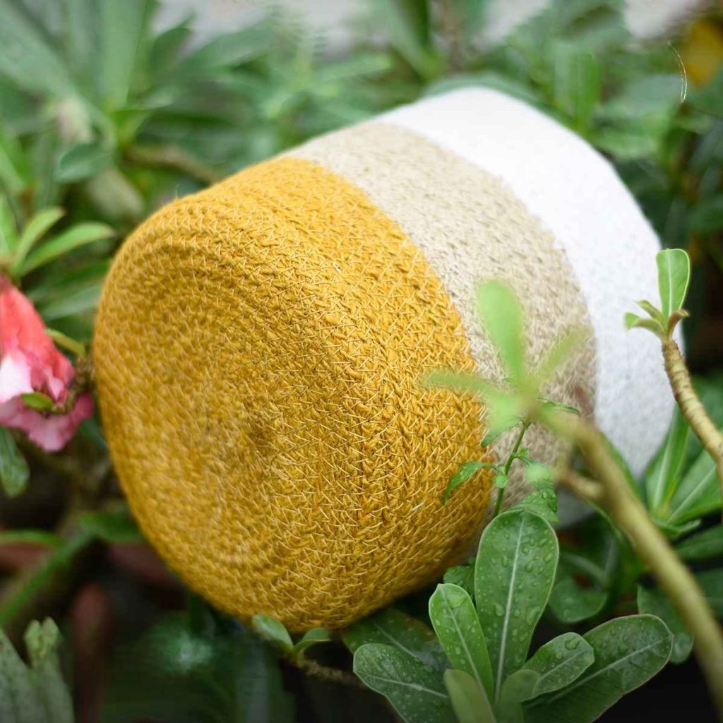 Jute baskets for plants lying on top of plants